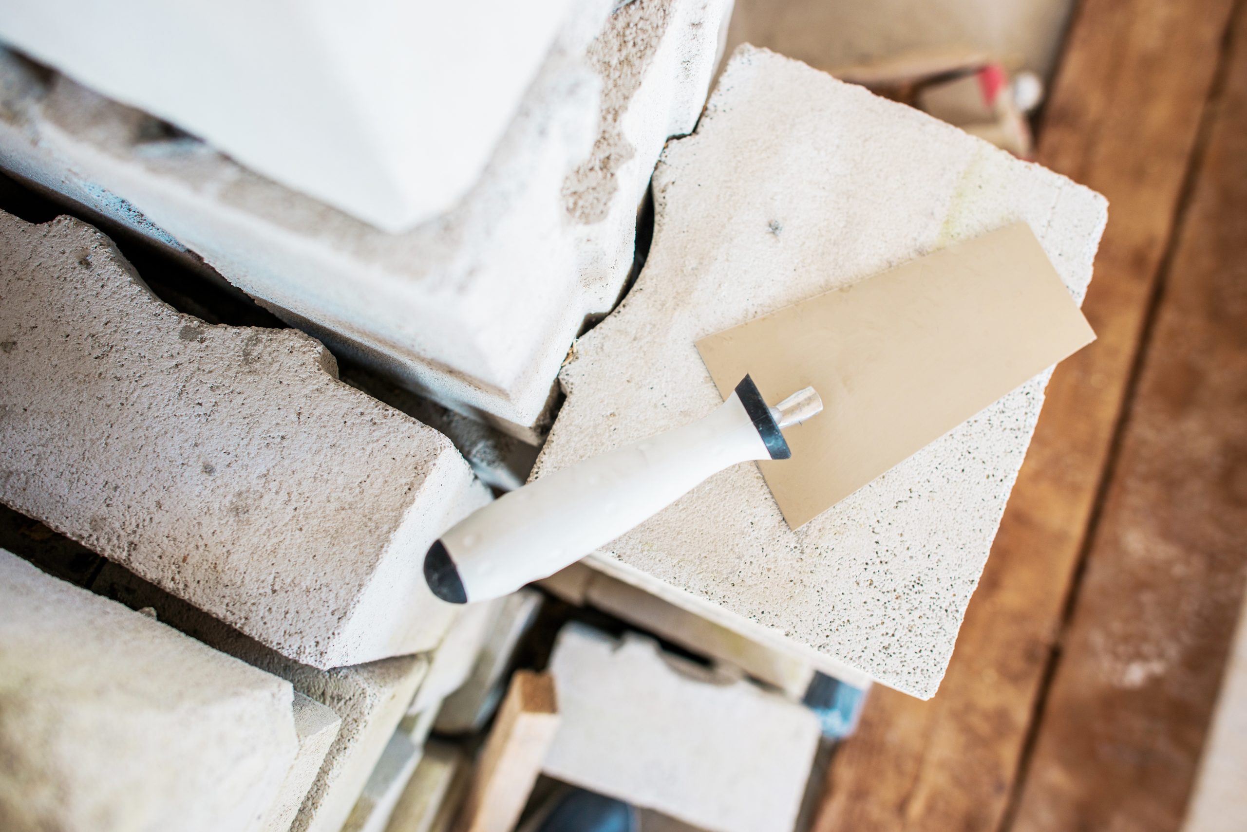 Brick Wall Building. Construction Tools and Materials. Trowel and the Bricks.